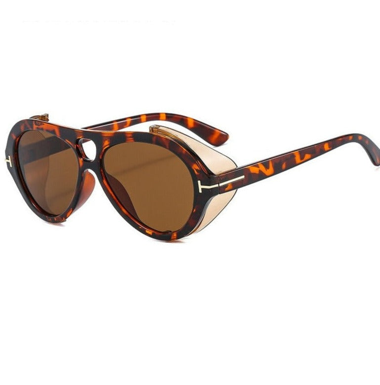 Leopard print sunglasses with a futuristic, retro vibe and goggle-like lenses.