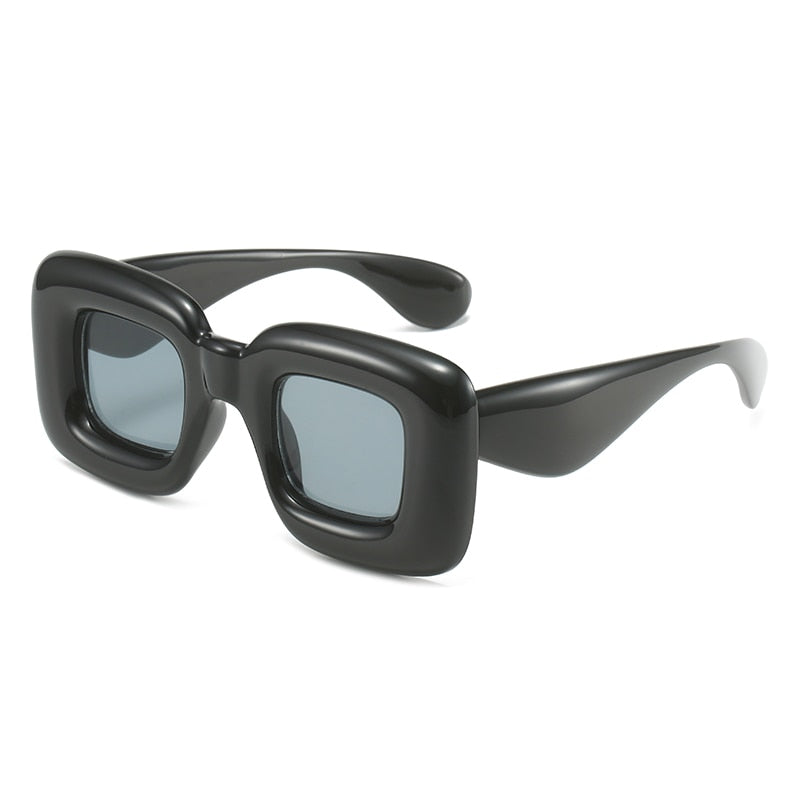 Elevate your accessory game with these oversized, inflated rectangular sunglasses.